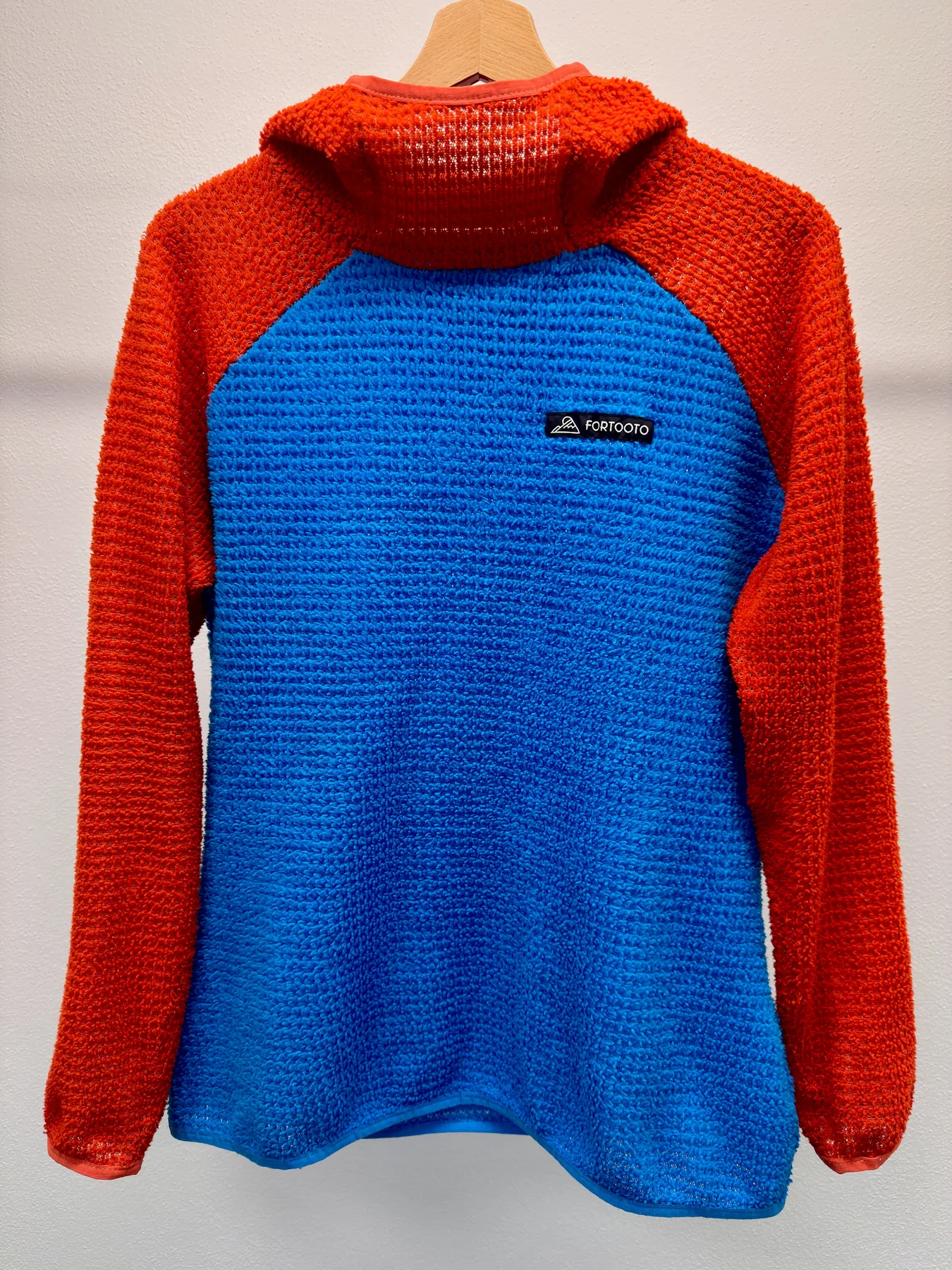 Front view of Sparks, a custom FORTOOTO Alpha 120 hoodie in red and blue