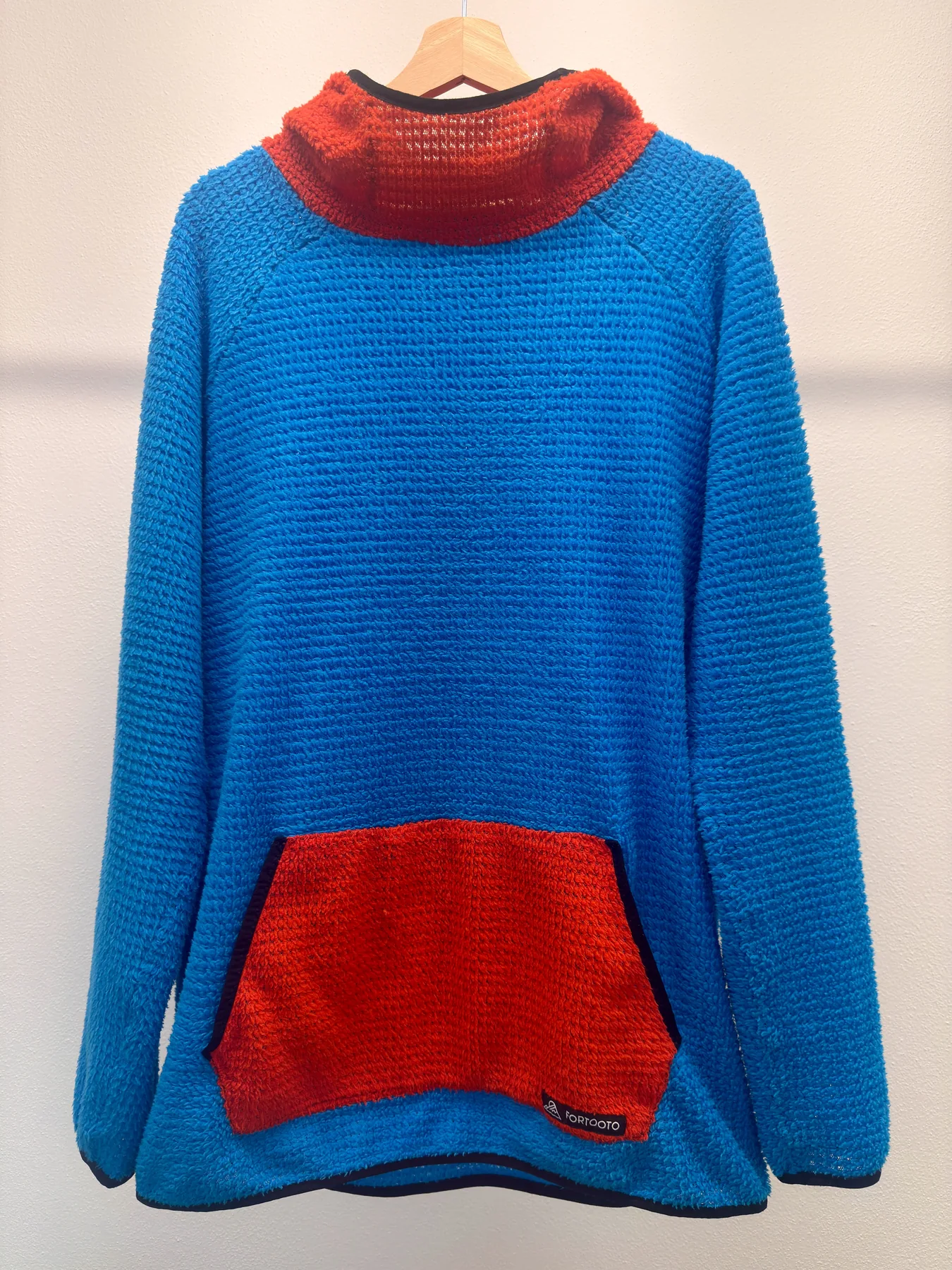 Front view of D J L.O.P.Y., a custom FORTOOTO Alpha 120 hoodie in blue and red