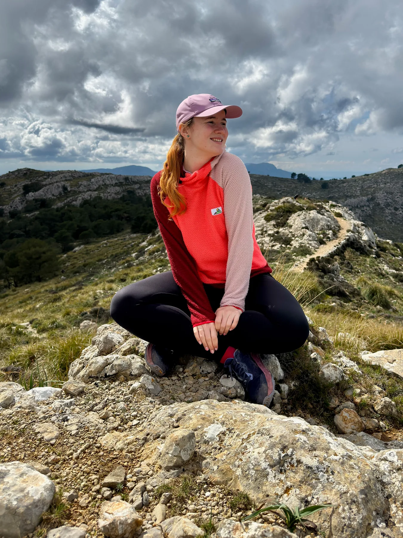 Flamingo Alpha 90 hoodie worn outdoors on Mallorca rocks