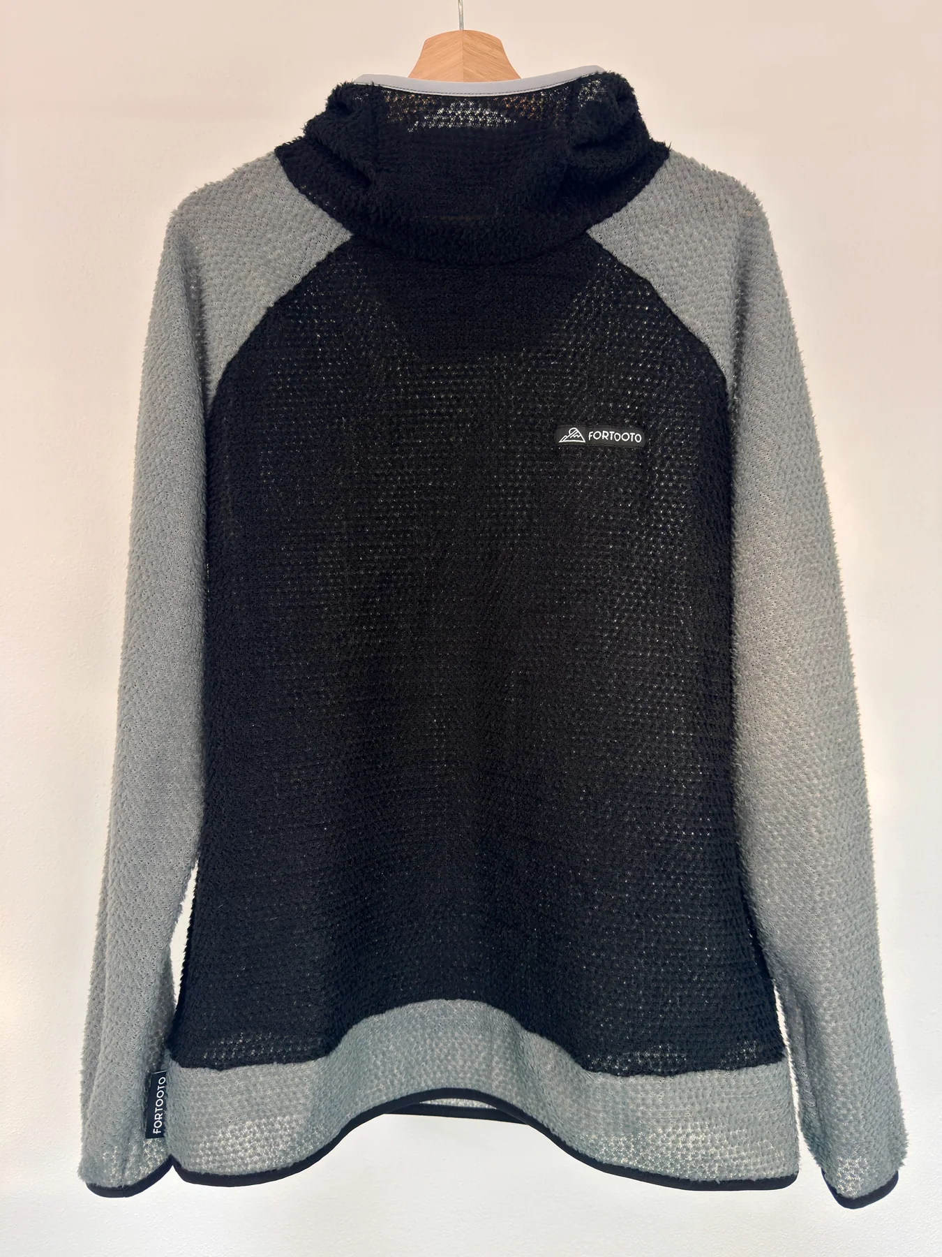 Front view of Uragan, a custom FORTOOTO Alpha 90 hoodie in black and castle rock